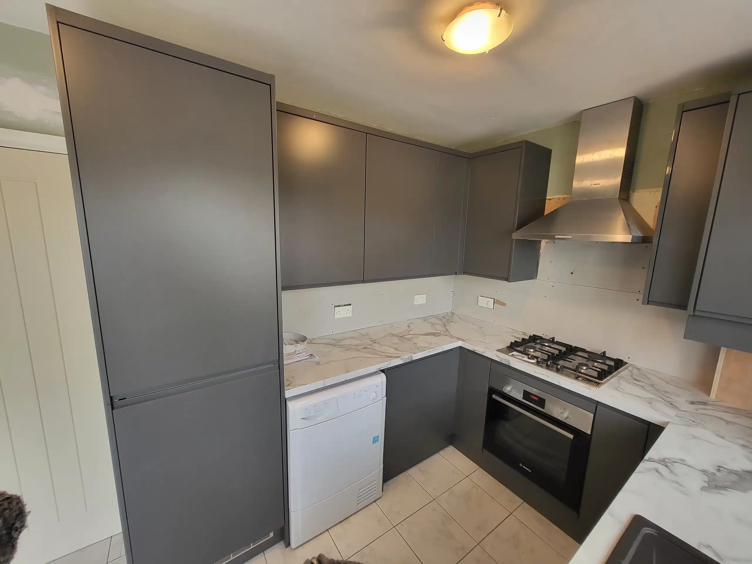 Modern kitchen fitting example second image showing an oven and stove-top