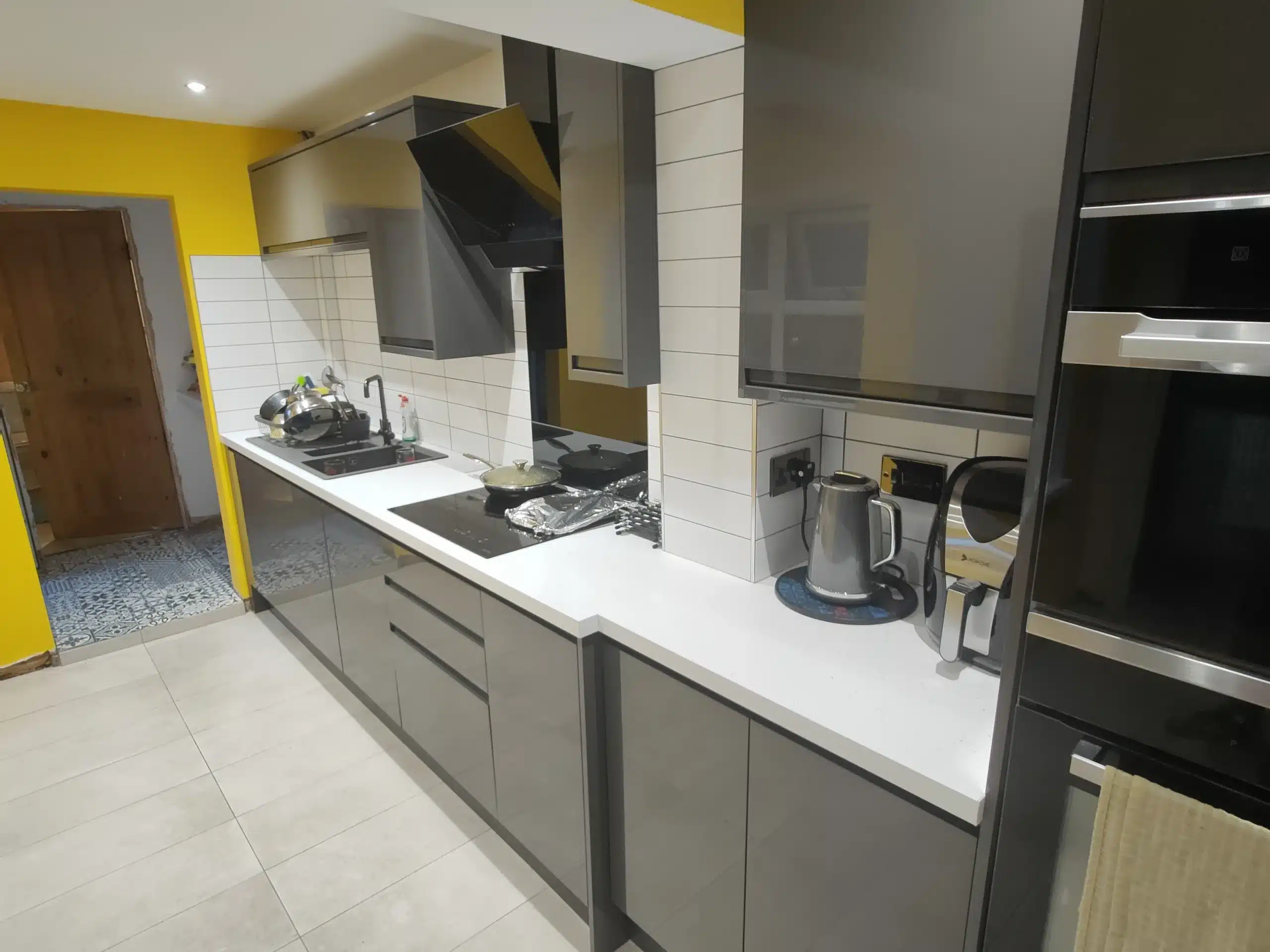 Kitchen fitting example first image, primarily focusing on the sink and counter-tops