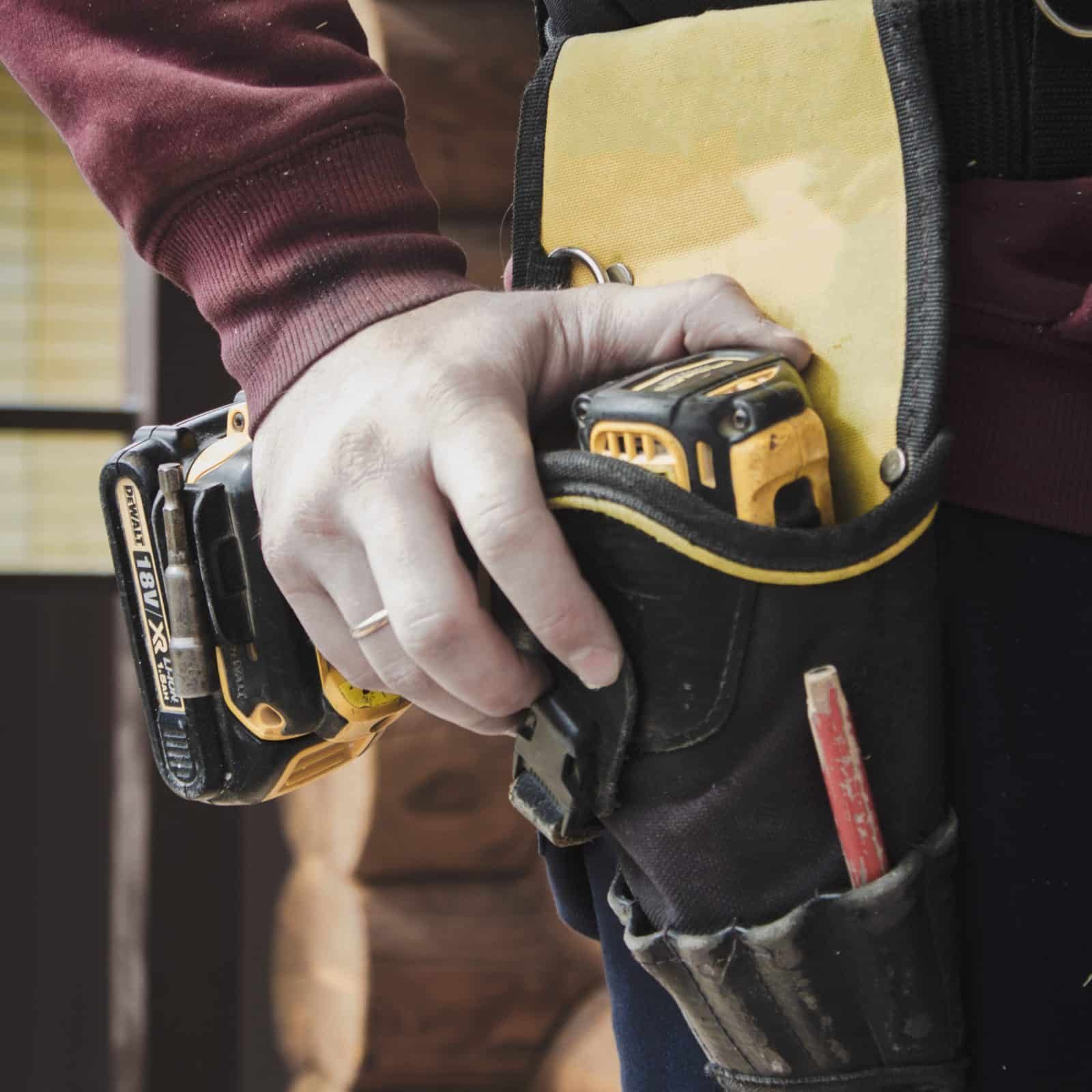 Second image highlighting an individual holding a power drill for the 24/7 emergency boarding section